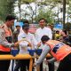 Petugas gabungan melakukan pengawasan di kawasan Taman Elektrik, Kota Tangerang, saat uji coba sterilisasi kendaraan untuk menekan parkir liar dan pungli.